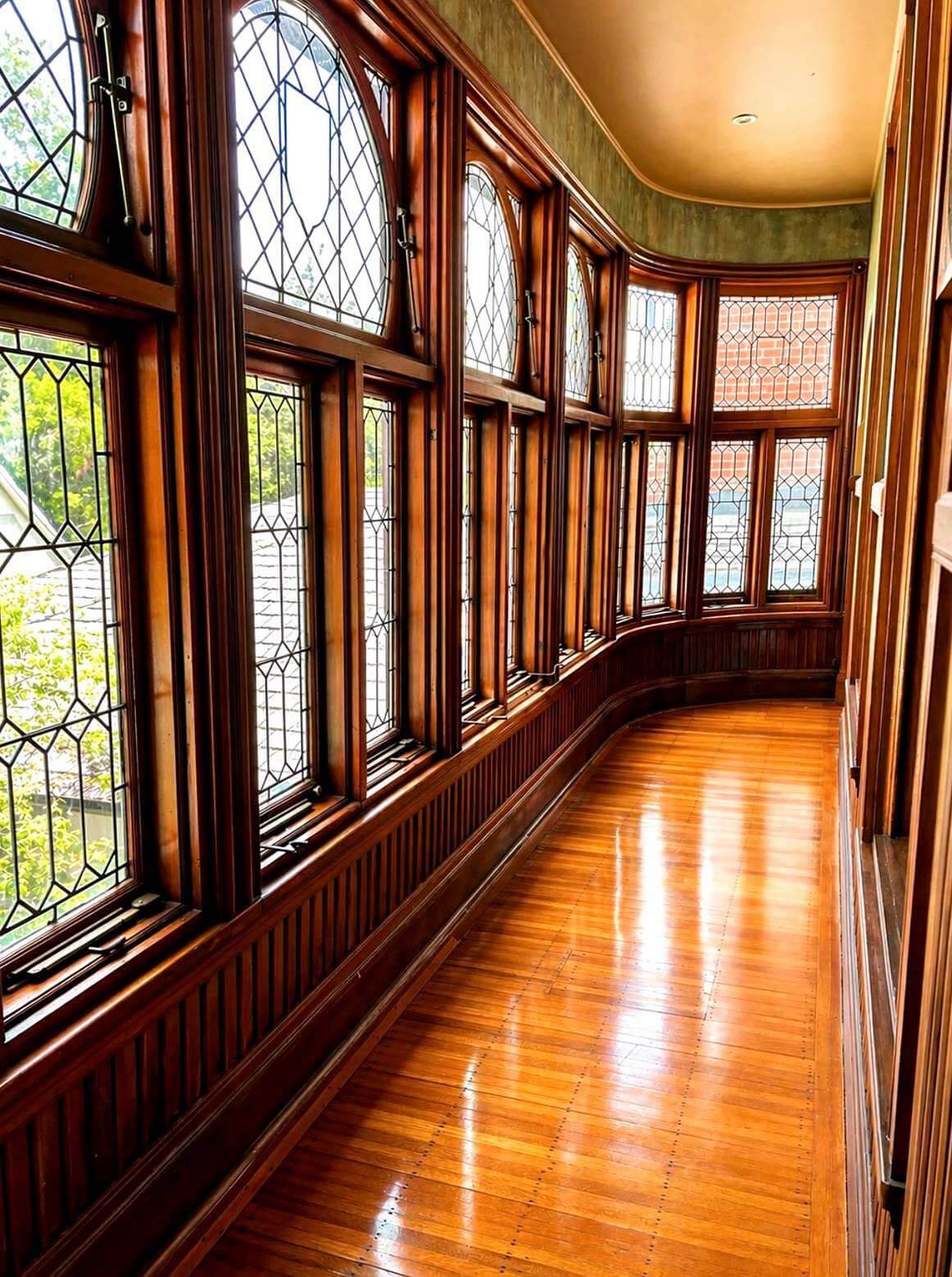 The mansion’s dining room, with its carved woodwork, stained glass and mosaic parquet floor