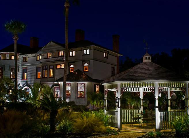 The Stetson Mansion lit up at night