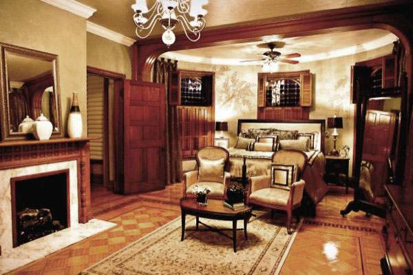 The reception parlor, with its fireplace and mosaic parquet floor