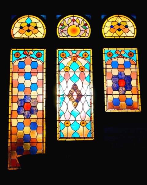 Three of the mansion’s original stained glass windows