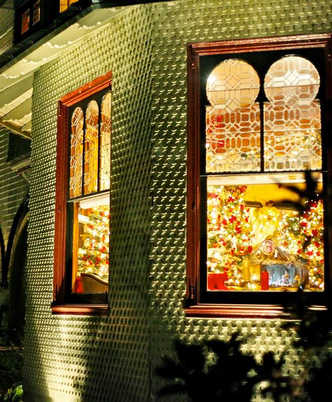 The Mansion’s windows glowing at night