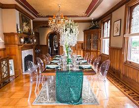 The dining room set for a wedding reception