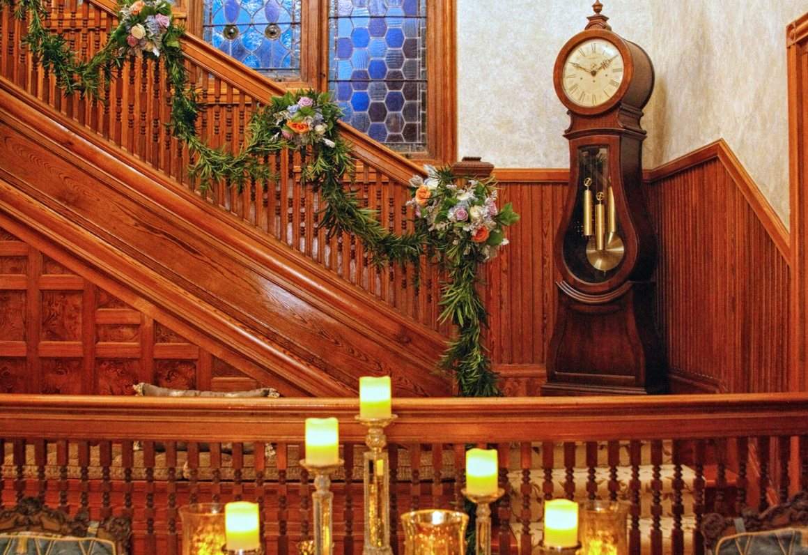 The main staircase dressed with garland and candles